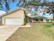 Charming one-story home featuring an attached garage and a well-manicured front yard, creating a welcoming curb appeal at 164 Morning Glory Dr, Lake Mary, FL 32746