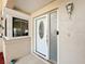 Close-up of front door with decorative glass and window showcasing the home's exterior at 164 Morning Glory Dr, Lake Mary, FL 32746