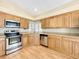 Galley kitchen featuring stainless steel appliances and granite countertops at 164 Morning Glory Dr, Lake Mary, FL 32746