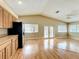 Open kitchen boasts stainless steel appliances and a bright eat-in area at 164 Morning Glory Dr, Lake Mary, FL 32746