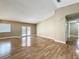 Spacious living room with wood flooring and natural light, creating a bright and welcoming atmosphere at 164 Morning Glory Dr, Lake Mary, FL 32746