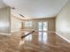 Open living space with wood floors and French doors, perfect for entertaining and relaxing at 164 Morning Glory Dr, Lake Mary, FL 32746