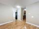 Open living room with a connecting kitchen and multiple rooms branching off the main space at 164 Morning Glory Dr, Lake Mary, FL 32746