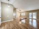 Large living area with wood floors and high ceilings creating a bright and inviting atmosphere at 164 Morning Glory Dr, Lake Mary, FL 32746