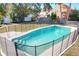 This fenced in pool is surrounded by lush greenery, creating a relaxing oasis in the backyard at 164 Morning Glory Dr, Lake Mary, FL 32746