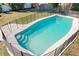 This fenced in pool is surrounded by lush greenery, creating a relaxing oasis in the backyard at 164 Morning Glory Dr, Lake Mary, FL 32746