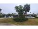 Ranch style home with mature landscaping and a spacious front yard at 167 Benjamin Dr, Ormond Beach, FL 32176