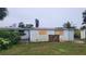 View of the back of the house needing repairs at 167 Benjamin Dr, Ormond Beach, FL 32176