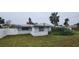 Rear view of the house showing a large backyard at 167 Benjamin Dr, Ormond Beach, FL 32176