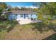 Sun-drenched backyard with patio and grassy area, providing a peaceful outdoor retreat at 1930 Albert Lee Pkwy, Winter Park, FL 32789