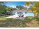 Spacious backyard with patio, fire pit, and grassy area, perfect for outdoor living at 1930 Albert Lee Pkwy, Winter Park, FL 32789