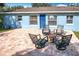Charming backyard patio with fire pit and seating area, perfect for outdoor entertaining at 1930 Albert Lee Pkwy, Winter Park, FL 32789