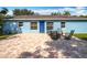 Backyard patio with fire pit and seating area at 1930 Albert Lee Pkwy, Winter Park, FL 32789