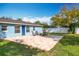 Spacious backyard with patio, fire pit, and grassy area, offering ample outdoor space at 1930 Albert Lee Pkwy, Winter Park, FL 32789