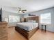 Spacious bedroom with wood flooring, large bed, and ceiling fan at 1930 Albert Lee Pkwy, Winter Park, FL 32789