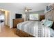 Bright bedroom with king-size bed and access to other rooms at 1930 Albert Lee Pkwy, Winter Park, FL 32789