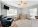 bedroom with crib, recliner, and ceiling fan at 1930 Albert Lee Pkwy, Winter Park, FL 32789