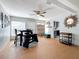 Bright dining area with a round table, four chairs, and wood-look flooring at 1930 Albert Lee Pkwy, Winter Park, FL 32789