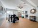Bright dining area with a round table, four chairs, and wood-look flooring at 1930 Albert Lee Pkwy, Winter Park, FL 32789