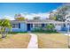 Cute light blue house with a walkway leading to the front door at 1930 Albert Lee Pkwy, Winter Park, FL 32789