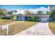 Light blue house with a white garage and a mailbox at 1930 Albert Lee Pkwy, Winter Park, FL 32789
