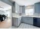 Renovated kitchen with gray cabinets and quartz countertops at 1930 Albert Lee Pkwy, Winter Park, FL 32789