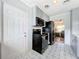 Modern kitchen with black appliances and patterned tile floors at 1930 Albert Lee Pkwy, Winter Park, FL 32789