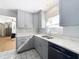 Gray kitchen cabinets, quartz countertops, and patterned floors at 1930 Albert Lee Pkwy, Winter Park, FL 32789