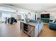 Open concept living and dining area with hardwood floors at 1930 Albert Lee Pkwy, Winter Park, FL 32789