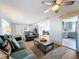 Open living room with view into kitchen and dining area at 1930 Albert Lee Pkwy, Winter Park, FL 32789