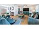 Living room with teal sofas and wood coffee table at 1930 Albert Lee Pkwy, Winter Park, FL 32789