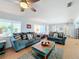Living room with two sofas, coffee table, and built-in shelves at 1930 Albert Lee Pkwy, Winter Park, FL 32789
