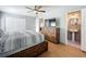Main bedroom with a rustic wood bed frame and en-suite bathroom at 1930 Albert Lee Pkwy, Winter Park, FL 32789