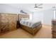 Main bedroom with a rustic wood platform bed and wood-look flooring at 1930 Albert Lee Pkwy, Winter Park, FL 32789