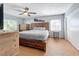 Main bedroom with a rustic wood platform bed and wood-look flooring at 1930 Albert Lee Pkwy, Winter Park, FL 32789
