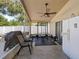 Screened patio with ceiling fan and home gym setup at 2349 Walnut Heights Rd, Apopka, FL 32703