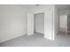 Spacious bedroom with double door closet and grey carpet at 2623 Sage Valley Way, Winter Haven, FL 33884