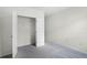 Bedroom with double door closet and grey carpet at 2623 Sage Valley Way, Winter Haven, FL 33884