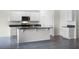 Modern kitchen with white cabinets and granite countertops at 2623 Sage Valley Way, Winter Haven, FL 33884