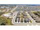 Aerial view of a new housing development with a community pool at 2630 Angel Falls Dr, Davenport, FL 33837