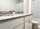 Bathroom featuring double sinks, granite countertops, and a shower at 2630 Angel Falls Dr, Davenport, FL 33837