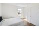 Well-lit bedroom with wood-style floors and a comfortable queen bed at 2630 Angel Falls Dr, Davenport, FL 33837
