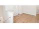Spacious upstairs bonus room with wood-style floors and neutral paint at 2630 Angel Falls Dr, Davenport, FL 33837