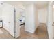 Light and airy hallway with wood-look floors and access to bedrooms at 2630 Angel Falls Dr, Davenport, FL 33837
