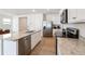Bright kitchen featuring stainless steel appliances, granite countertops, and a large center island at 2630 Angel Falls Dr, Davenport, FL 33837