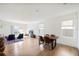 Living room with hardwood floors and dining area at 2630 Angel Falls Dr, Davenport, FL 33837