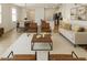 Inviting living space with an open floor plan connecting the living room, dining area and kitchen at 2630 Angel Falls Dr, Davenport, FL 33837