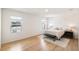 Spacious bedroom features wood-style floors, natural light, and neutral paint at 2630 Angel Falls Dr, Davenport, FL 33837
