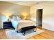 Comfortable bedroom with a queen size bed, wood-style floors, and neutral paint at 2630 Angel Falls Dr, Davenport, FL 33837