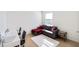 Home office with desk, comfy couch and plenty of light at 2630 Angel Falls Dr, Davenport, FL 33837